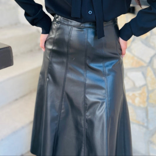 black faux leather skirt, vegan leather skirt, pleather midi skirt, flared leather skirt, black midi skirt, side zip skirt, chic black skirt, fall fashion outfit, edgy leather skirt, versatile skirt, boutique midi skirt, trendy faux leather skirt, vegan leather fashion, statement skirt, dressy black skirt, women’s midi skirt, street style outfit, fall outfit idea, night out skirt