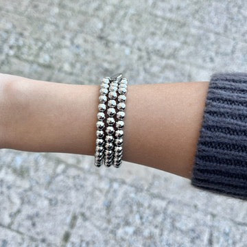 silver bracelet set, stackable silver bracelets, beaded silver jewelry, B.B. Lila bracelets, silver layering bracelets, minimalist silver jewelry, tarnish free bracelets, rust free jewelry, grand silver bracelet set, petite silver bracelet set, bold silver beads, dainty silver beads, silver arm stack, chic everyday accessories, silver jewelry gift, boutique style bracelets