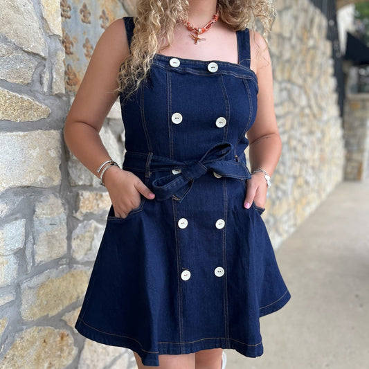denim mini dress, dark wash denim dress, button front denim dress, a-line jean dress, belted denim dress, denim sash tie dress, adjustable strap dress, square neckline dress, casual denim outfit, flirty jean dress, boutique denim dress, modern western style, fall denim trends, classic blue jean dress, women’s denim fashion, dress with belt loops, everyday denim dress, chic denim mini, versatile denim dress, cute denim day dress, trendy denim outfit, stylish boutique dress, elevated casual denim