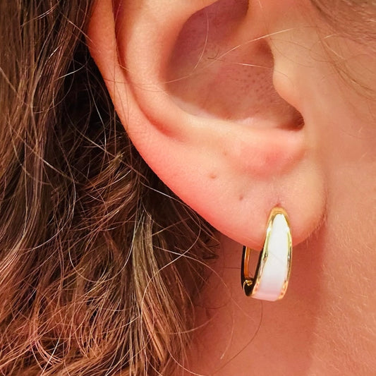 sleek minimalist hoop earrings, glossy white enamel earrings, gold and white hoop earrings, small everyday hoops, modern minimalist jewelry, lightweight hoop earrings, chic gold hoops, versatile everyday earrings, white accent hoop earrings, polished gold hoop jewelry, casual to dressy earrings, gold metal hoop accessories, mini hoop earrings for women, trendy small hoops, enamel detail earrings