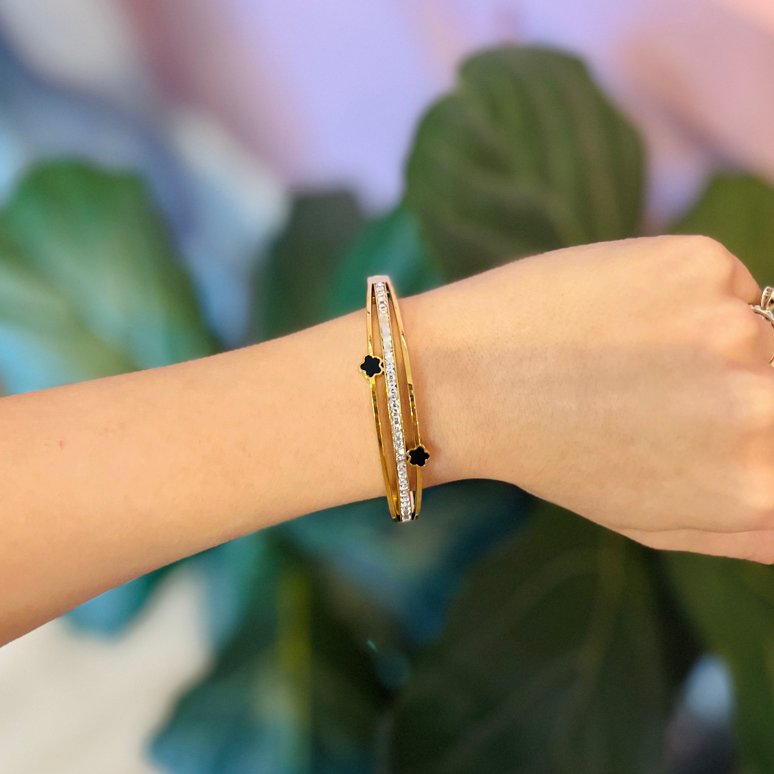 gold bracelet cuff, rhinestone bracelet, flower cuff bracelet, clover detail bracelet, gold plated bracelet, stainless steel jewelry, cubic zirconia bracelet, sparkly bracelet, girly bracelet, trendy gold cuff, everyday jewelry, boutique bracelet, stacking bracelet, dainty cuff bracelet, floral detail bracelet, chic gold accessory, crystal bracelet, fashion jewelry, women’s cuff bracelet, clover bracelet, clover