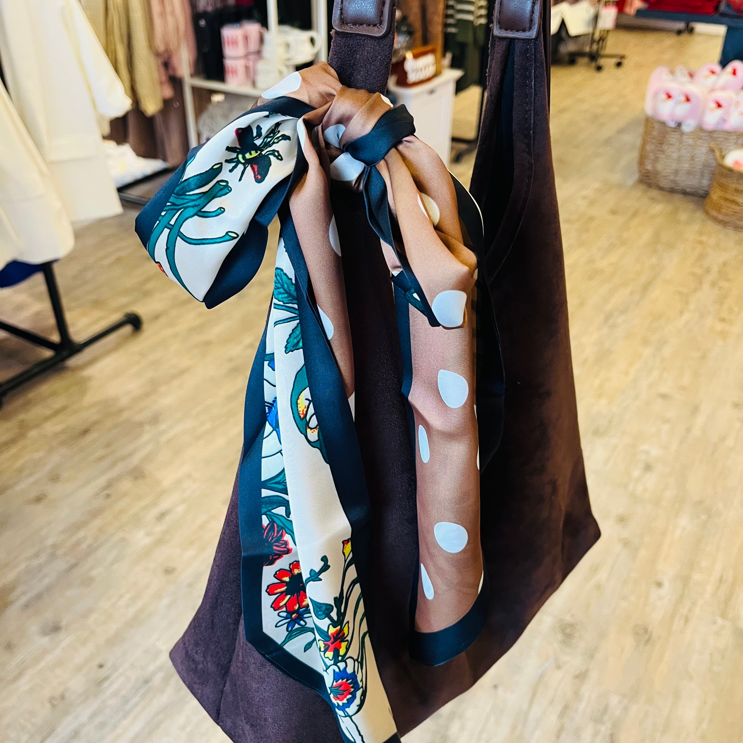 long tapered scarf, silky long scarf, slim ribbon scarf, versatile hair scarf, neck scarf accessory, bag tie scarf, dual pattern scarf, multicolor leopard scarf, black floral scarf, lightweight silky scarf, 50 inch long scarf, patterned ribbon scarf, fashion accessory scarf, colorful slim scarf, trendy twilly style scarf, elongated scarf for women, chic styling scarf, statement print scarf