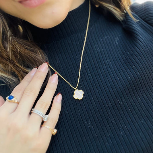 opal clover necklace, designer inspired necklace, gold clover pendant, dainty gold necklace, opal enamel jewelry, pearl enamel clover, adjustable chain necklace, 14k gold dipped necklace, timeless everyday jewelry, elegant layering necklace, minimalist gold necklace, chic statement necklace, creamy opal pendant, luxe dainty necklace, gold hardware jewelry, sophisticated clover charm, trendy gold accessory, lightweight necklace, clover jewelry, classic gold pendant