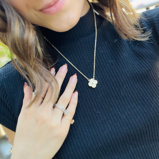 gold clover necklace, designer inspired jewelry, textured clover pendant, dainty gold necklace, 14k gold plated necklace, everyday layering necklace, minimalist gold jewelry, chic statement necklace, lucky clover charm, timeless gold accessory, lightweight dainty necklace, adjustable chain necklace, classic gold pendant, elegant layering piece, solid gold hardware, stylish clover necklace, trendy gold jewelry, feminine gold necklace, versatile necklace for stacking, delicate gold chain