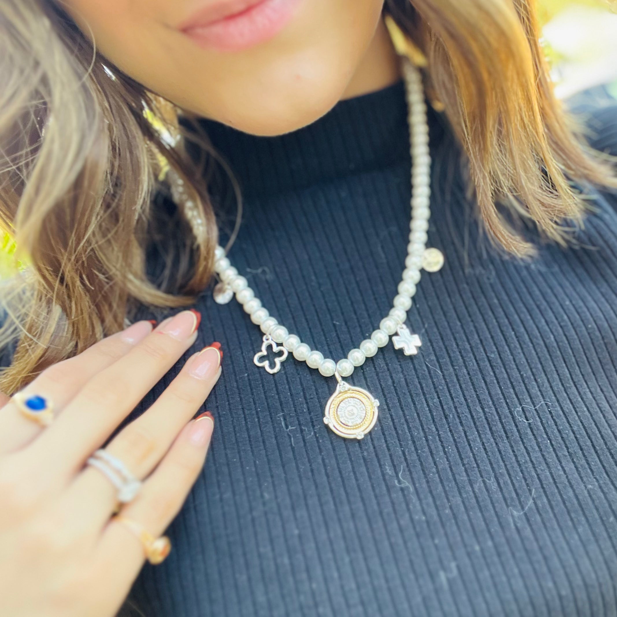 pearl charm necklace, dainty pearl jewelry, charm pendant necklace, mixed metal necklace, gold and silver necklace, pearl chain necklace, elegant layered necklace, timeless pearl necklace, chic everyday jewelry, necklace and earring set, simple stud earrings, giftable jewelry set, feminine charm necklace, classy gold silver jewelry, delicate pearl chain, versatile layering necklace, non hypoallergenic necklace, pearl jewelry gift idea, statement charm necklace, elevated everyday style