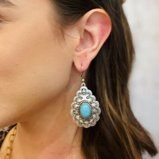western turquoise earrings, rodeo chic jewelry, silver turquoise earrings, teardrop turquoise earrings, double circle pendant earrings, southwestern style jewelry, cowgirl earrings, boho western accessories, lightweight dangle earrings, french wire earrings, intricate western design, silver metal earrings, turquoise statement earrings, rodeo concert jewelry, desert inspired earrings, bohemian cowgirl style, silver turquoise drop earrings, western fashion accessories, turquoise gemstone look, country chic ea