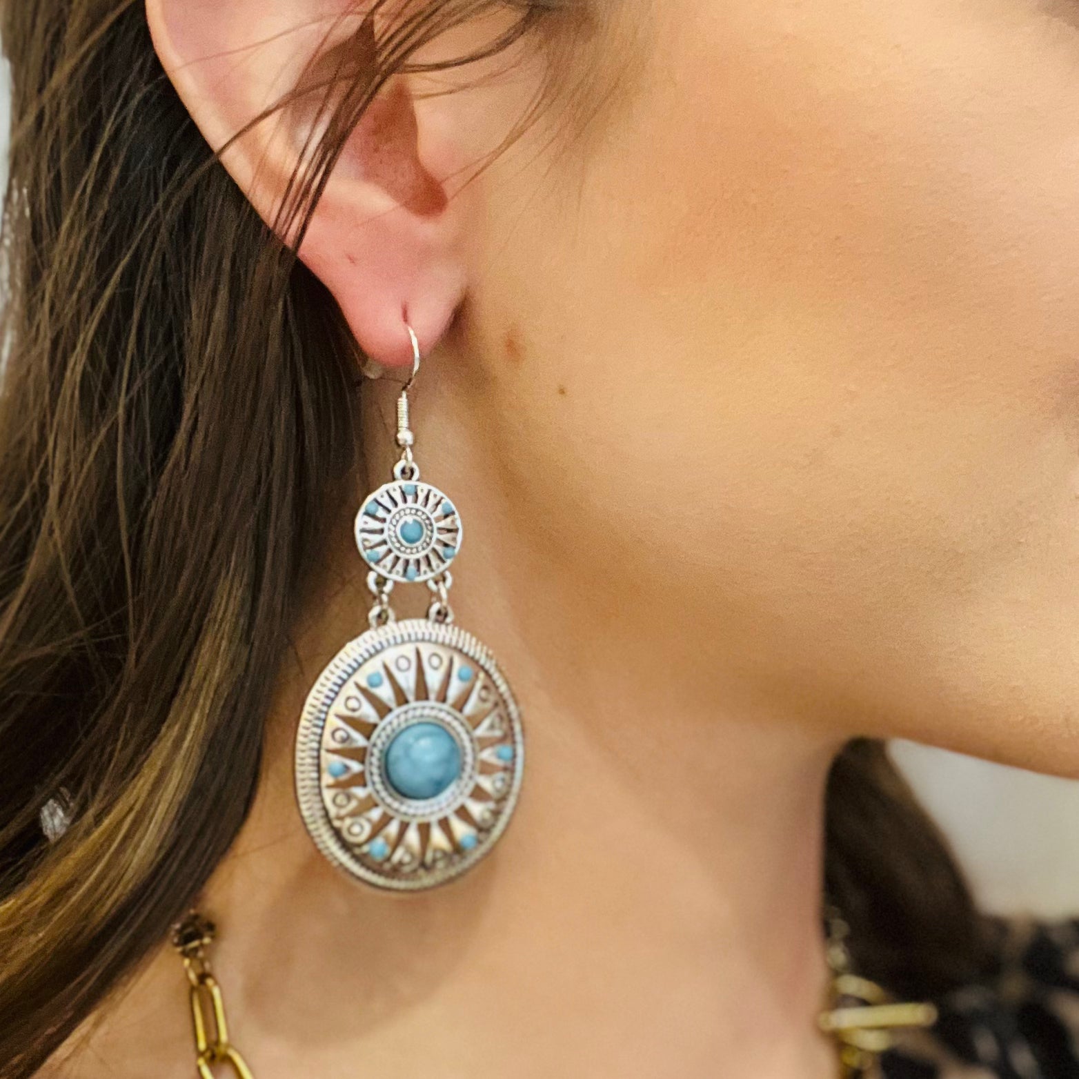 western turquoise earrings, rodeo chic jewelry, silver turquoise earrings, teardrop turquoise earrings, double circle pendant earrings, southwestern style jewelry, cowgirl earrings, boho western accessories, lightweight dangle earrings, french wire earrings, intricate western design, silver metal earrings, turquoise statement earrings, rodeo concert jewelry, desert inspired earrings, bohemian cowgirl style, silver turquoise drop earrings, western fashion accessories, turquoise gemstone look, country chic ea