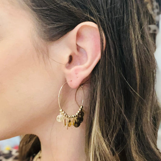 circle pendant hoops, hammered gold earrings, textured gold hoops, artisan style earrings, beaded detail hoops, lightweight gold earrings, chic everyday jewelry, gold metal hoops, dainty hammered pendants, minimalist statement earrings, timeless gold hoops, casual to dressy earrings, non hypoallergenic earrings, not water resistant jewelry, versatile gold accessories, everyday hoop earrings, gold circle dangle earrings, subtle texture earrings, modern boho hoops, simple gold statement jewelry