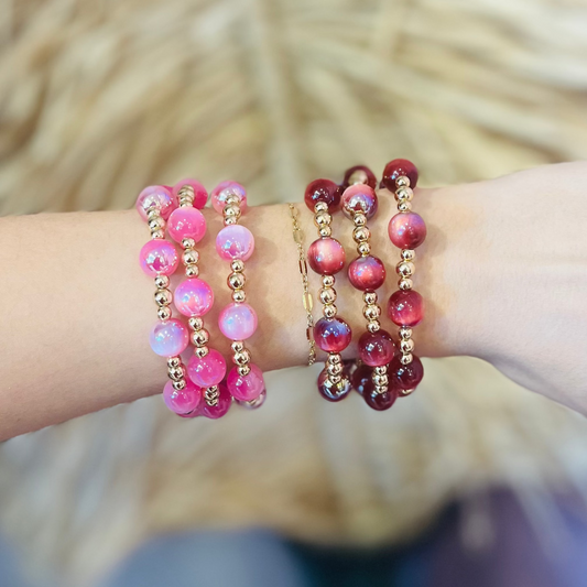 glass bead bracelets, iridescent bracelets, gold bead bracelet set, red bracelet set, pink bracelet set, beaded jewelry, stacking bracelets, mix and match bracelets, lightweight bracelets, boho chic jewelry, everyday bracelet set, glam accessories, bracelet stack, colorful beaded bracelets, gold hardware jewelry, trendy bracelet set, versatile bracelet set, statement bracelets, dainty bead bracelets, gift for her