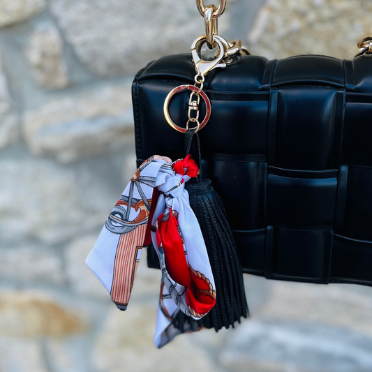 tassel scarf bow charm, purse charm accessory, satin bag charm, multicolor keychain, scarf bow keyring, tassel bag accessory, gold hardware purse charm, attachable bag charm, backpack keychain charm, silky satin bow charm, decorative purse accessory, trendy bag charm, boho chic keychain, multicolor tassel charm, statement purse keychain, fashionable bag accessory, gift idea for her, playful purse charm, colorful keyring accessory, stylish handbag charm