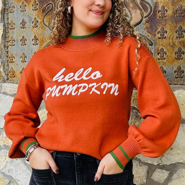 hello pumpkin sweater, fall graphic sweater, pumpkin orange sweater, cozy fall pullover, balloon sleeve sweater, relaxed fit sweater, autumn graphic sweatshirt, festive fall top, crew neck sweater, green trim sweater, cute fall outfit, cozy pumpkin sweater, seasonal knit top, playful fall fashion, thanksgiving sweater, casual autumn outfit, bold lettering sweater, comfy fall essential, statement fall sweater, trendy graphic knit