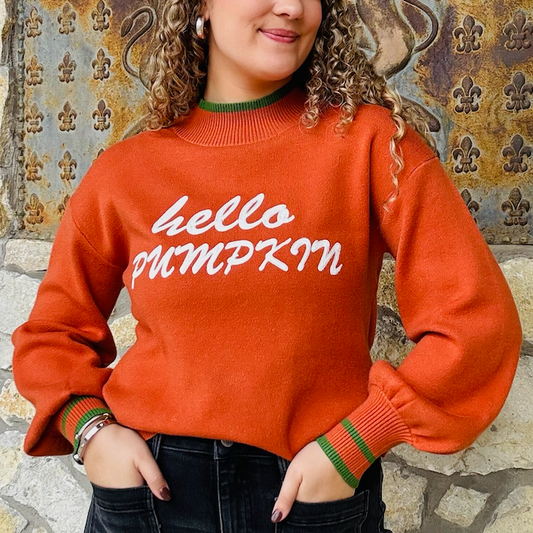 hello pumpkin sweater, fall graphic sweater, pumpkin orange sweater, cozy fall pullover, balloon sleeve sweater, relaxed fit sweater, autumn graphic sweatshirt, festive fall top, crew neck sweater, green trim sweater, cute fall outfit, cozy pumpkin sweater, seasonal knit top, playful fall fashion, thanksgiving sweater, casual autumn outfit, bold lettering sweater, comfy fall essential, statement fall sweater, trendy graphic knit