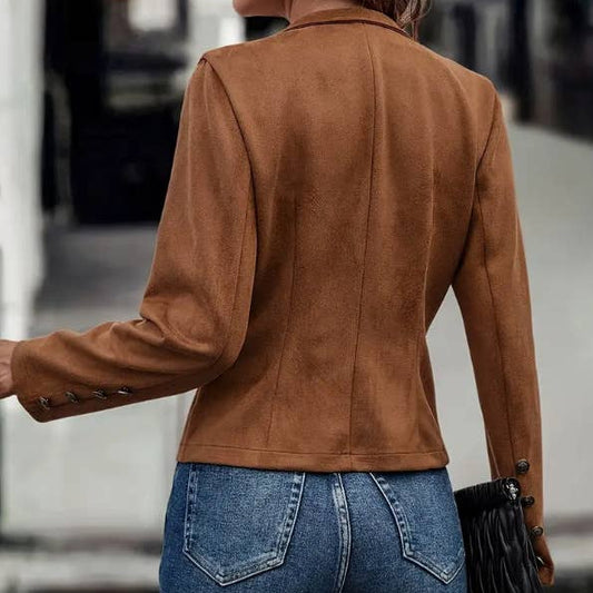 vintage suede jacket, deerskin jacket, faux deerskin jacket, suede mock neck jacket, single breasted jacket, button detail jacket, structured collar jacket, long sleeve suede jacket, vintage inspired outerwear, fall suede jacket, chic suede jacket, soft touch suede jacket, timeless statement jacket, elevated outerwear, boutique suede jacket, women’s suede jacket, classic neutral jacket, minimalist layering jacket, refined fall jacket